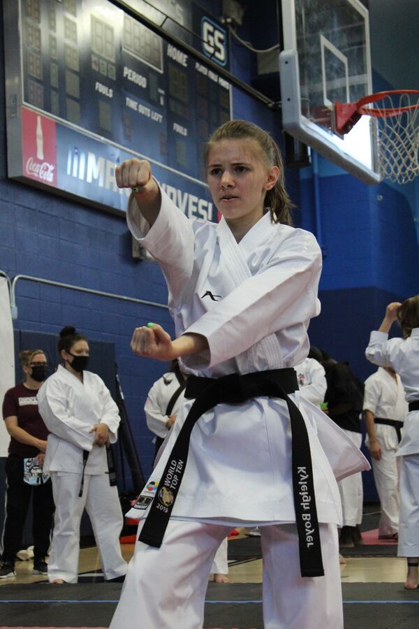 Karate competitor performing at a tournament