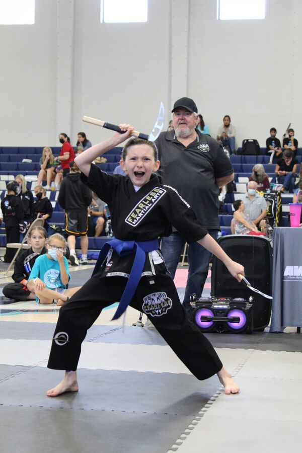 Karate competitor performing at a tournament